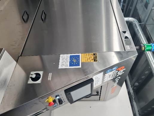 The image shows a stainless steel food processing machine with various buttons, screens, and European Union labels, indicating it is part of a certified environmental risk management system.

AI-generated content may be incorrect.